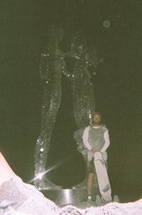 a person standing in front of a statue