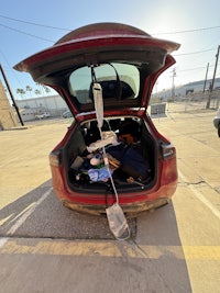 a red car with its trunk open