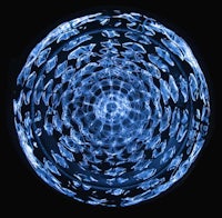 an image of a blue glass ball on a black background