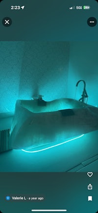 a picture of a bathtub with a blue light on it